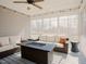 Inviting screened porch features comfortable wicker furniture and a gas firepit at 65 Walking Trl, Youngsville, NC 27596