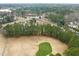 Aerial view of golf course community with mature trees at 7 Windsor Glen Dr, Durham, NC 27703