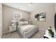 Cozy bedroom featuring neutral tones, carpeted floors, and natural light at 7 Windsor Glen Dr, Durham, NC 27703