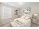 Cozy bedroom featuring neutral tones, carpeted floors, and natural light at 7 Windsor Glen Dr, Durham, NC 27703