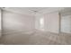 Spacious bedroom with neutral walls, carpet, and a ceiling fan at 7 Windsor Glen Dr, Durham, NC 27703