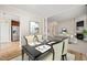 Formal dining room with elegant table setting, neutral color palette, and open floor plan at 7 Windsor Glen Dr, Durham, NC 27703