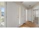 Bright entryway with hardwood flooring and a transom window at 7 Windsor Glen Dr, Durham, NC 27703
