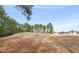 Distant view of a residential property near the lush golf course at 7 Windsor Glen Dr, Durham, NC 27703