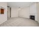Large living room with fireplace, neutral color palette, and light-tone flooring at 7 Windsor Glen Dr, Durham, NC 27703