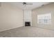 Cozy living room with fireplace, neutral color palette, and bright natural light at 7 Windsor Glen Dr, Durham, NC 27703