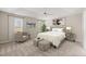 Spacious main bedroom featuring tray ceilings, plush carpet, and natural light at 7 Windsor Glen Dr, Durham, NC 27703