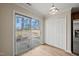 Light-filled sunroom featuring sliding glass doors to the backyard and storage closet at 7 Windsor Glen Dr, Durham, NC 27703