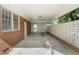 Covered carport area providing ample parking and storage with access to home's side entrance at 709 Fitzgerald Dr, Raleigh, NC 27610