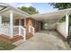 View of the home's covered carport leading to the side entrance with access to storage at 709 Fitzgerald Dr, Raleigh, NC 27610