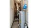 Utility room featuring modern water heater and HVAC system, with visible pipes and electrical components at 709 Fitzgerald Dr, Raleigh, NC 27610