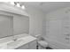 Bathroom featuring a modern vanity with white countertop and cabinetry, plus a tub and shower combination at 801 Berkeley Glen Rd, Zebulon, NC 27597