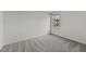 Bright bedroom featuring neutral carpet and walls, with natural light coming through the window at 801 Berkeley Glen Rd, Zebulon, NC 27597