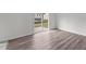 Living room featuring hardwood floors and a sliding glass door at 801 Berkeley Glen Rd, Zebulon, NC 27597