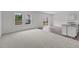 Spacious living room featuring carpeted floors and natural light at 801 Berkeley Glen Rd, Zebulon, NC 27597