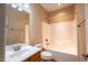 Bathroom with vanity, large mirror and a combined tub and shower at 804 Long Meadows Rd, Chapel Hill, NC 27516