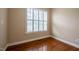Bright room with hardwood floors and a window with white shutters at 804 Long Meadows Rd, Chapel Hill, NC 27516