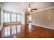 Bright bedroom with hardwood floors, ceiling fan, and ensuite bathroom at 804 Long Meadows Rd, Chapel Hill, NC 27516