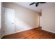 Bedroom with hardwood floors, neutral paint and a ceiling fan at 804 Long Meadows Rd, Chapel Hill, NC 27516