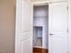 Spacious walk in closet with wooden floors and a small door at 804 Long Meadows Rd, Chapel Hill, NC 27516