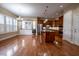 Open-concept kitchen and dining area featuring custom cabinets, granite counters, and stainless appliances at 804 Long Meadows Rd, Chapel Hill, NC 27516