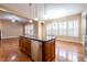 Open kitchen with island, stainless steel appliances, granite countertops and abundant natural light at 804 Long Meadows Rd, Chapel Hill, NC 27516