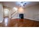 Spacious living room with hardwood floors, fireplace, and staircase to the second floor at 804 Long Meadows Rd, Chapel Hill, NC 27516