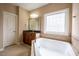 Bathroom featuring a soaking tub, vanity, and tile floors at 804 Long Meadows Rd, Chapel Hill, NC 27516