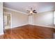 Large main bedroom with hardwood floors, ceiling fan, and ensuite bathroom at 804 Long Meadows Rd, Chapel Hill, NC 27516