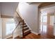 Carpeted staircase with white railings, hardwood floors and natural lighting at 804 Long Meadows Rd, Chapel Hill, NC 27516