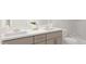 Bright bathroom features double sinks, marble countertops, and a white color palette at 81 St Andrews Dr, Zebulon, NC 27597
