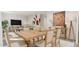 Open-concept dining area featuring a light wood table set with seating for six and living space at 81 St Andrews Dr, Zebulon, NC 27597