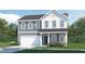 Two-story home with a gray and white exterior, two car garage, and charming curb appeal at 81 St Andrews Dr, Zebulon, NC 27597