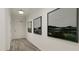Hallway featuring stylish paintings and neutral walls at 81 St Andrews Dr, Zebulon, NC 27597