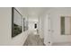 Hallway featuring stylish paintings and neutral walls at 81 St Andrews Dr, Zebulon, NC 27597