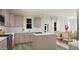 Spacious kitchen featuring stainless steel appliances, an island, and light-colored cabinets at 81 St Andrews Dr, Zebulon, NC 27597