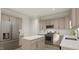Beautiful kitchen featuring stainless steel appliances, a large island, and light-colored cabinets at 81 St Andrews Dr, Zebulon, NC 27597