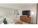 Bright living room with a tv, a side board, and a round coffee table at 81 St Andrews Dr, Zebulon, NC 27597
