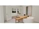 Well-lit home office with a wooden desk and modern decor at 81 St Andrews Dr, Zebulon, NC 27597