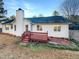 Back exterior of a home showing the backyard and patio at 8425 Fawncrest Dr, Raleigh, NC 27603