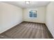 This bedroom is brightly lit with a view of outside from the single window at 8425 Fawncrest Dr, Raleigh, NC 27603