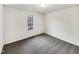 Bright bedroom with a large window, neutral walls and carpeting, ready to be personalized at 8425 Fawncrest Dr, Raleigh, NC 27603
