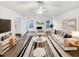 Bright living room featuring a vaulted ceiling, fireplace, and stylish decor at 8425 Fawncrest Dr, Raleigh, NC 27603