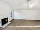 Living room featuring neutral walls, carpet and fireplace at 8425 Fawncrest Dr, Raleigh, NC 27603