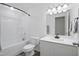 Bright bathroom with shower-tub combination and modern vanity at 88 Molly Mac Ln, Angier, NC 27501