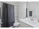 Well-lit bathroom with shower-tub combination and modern vanity at 88 Molly Mac Ln, Angier, NC 27501