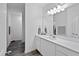 Sleek bathroom vanity with dual sinks, modern fixtures and tile flooring at 88 Molly Mac Ln, Angier, NC 27501