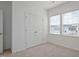 Cozy bedroom with neutral carpet, large windows and a spacious closet at 88 Molly Mac Ln, Angier, NC 27501