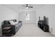 Neutral bonus room with a comfortable couch and modern TV at 88 Molly Mac Ln, Angier, NC 27501