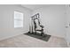 Bright exercise room featuring carpet floors and a multi-station home gym at 88 Molly Mac Ln, Angier, NC 27501